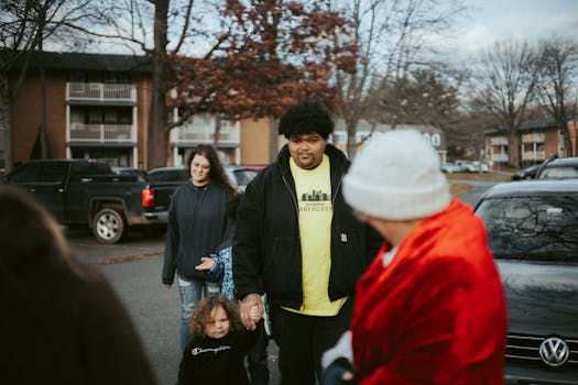 Family walking together in a neighborhood, highlighting community bonds.